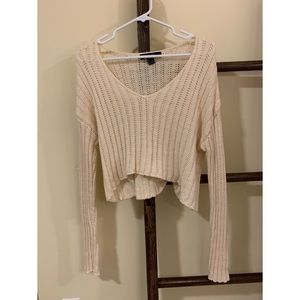 Cropped cable knit sweater
